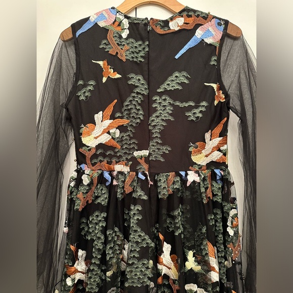 Vibrant beaded dress with a nature scene and she arms - Picture 9 of 11